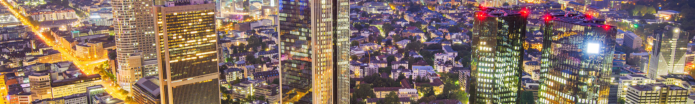 A city by night, showing offices and skyscrapers